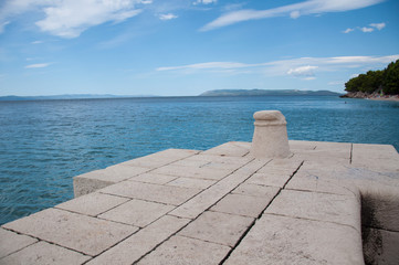 Fototapeta premium coast of tucepi mare stones and blue sky