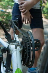 boy repairing a bicycle wheel