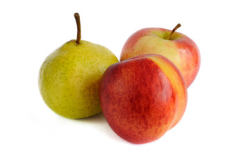 nectarine and pear and apples are located as a triangle on a white background