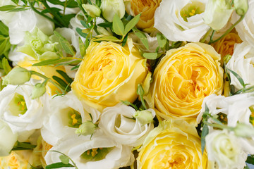 bunch of white eustoma and yellow roses flowers, green leaf Fresh spring bouquet. Summer Background