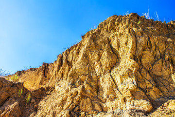 red clay cliff rock, sky background