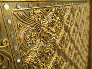 Beautiful wooden craft gold-painted art pattern.