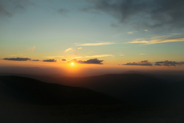 sunset or sunrise in mountains