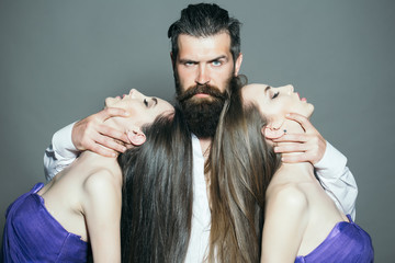 Bearded man and two women