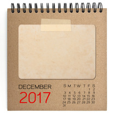 2017 calendar on brown notebook with old blank photo