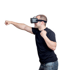 Man with virtual reality glasses fighting in a video game