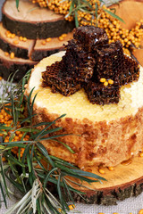 Homemade honey cakes with honeycom and sea buckthorn. Autumn still life. Close up.