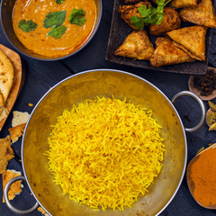 Indian pilau rice in balti dish served with chicken tikka masala