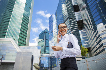 Young brunette woman calling by phone