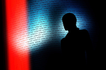 Silhouette of a hacker,Abstract blue light background