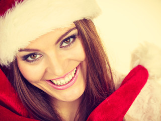 Woman in santa claus hat free and happy laughing