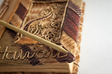 pencil and entic book on white backgrounds