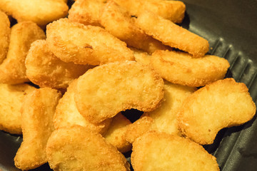 chicken nuggets served in pan