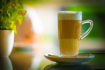 Cup of coffee latte macchiato in coffee shop