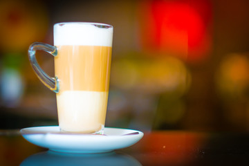Cup of coffee latte macchiato in coffee shop