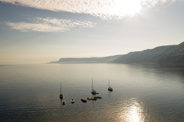 Naklejka premium sea view in backlight with moored boats