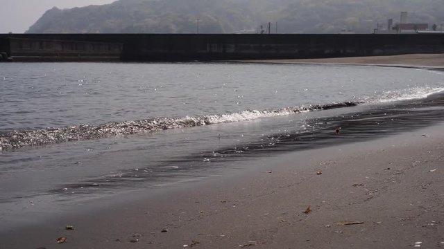 Waves crashing on the shore in slow-motion, Izu Peninsula, Japan