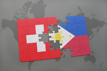 puzzle with the national flag of switzerland and philippines on a world map background.