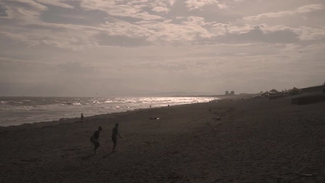 Slow motion footage of people on the beach at sunset in Enoshima, Kanagawa Prefecture, Japan