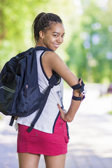 Lifestyle Concepts. Portrait of Happy Positive African American Teenager Posing With Smile in Park