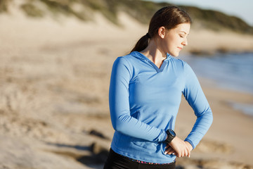 Young couple on beach training together