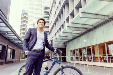 Fototapeta na wymiar Successful businessman with bicycle