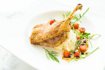 Fried leg duck with potato salad