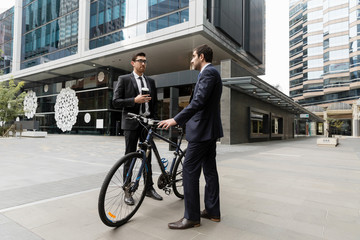 Young businessmen with a bike