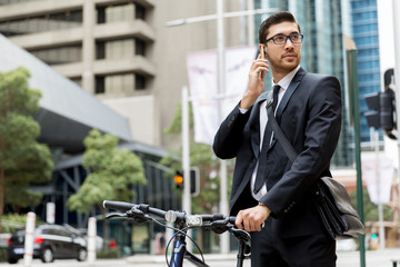 Young businessmen with a bike