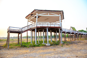 Fototapeta na wymiar Dry or arid lake with old vintage pavilion.