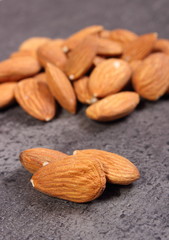 Heap of almonds on concrete structure