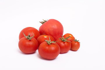 red ripe tomatoes on white background