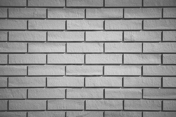 White brick tile wall seamless background and texture..