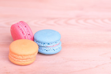 macarons sweet beauty dessert on wood background pink color tone.