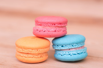macarons sweet beauty dessert on wood background pink color tone.