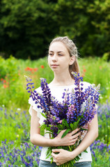 girl with bouquet of lupine flowers