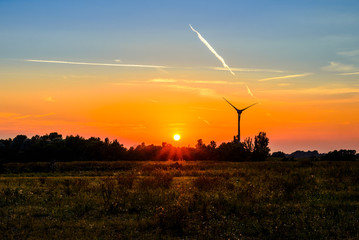 Fototapeta na wymiar sunset behind the windmill