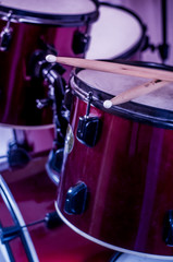 Fototapeta na wymiar Drums conceptual image. Picture of drums and drumsticks lying on snare drum.