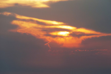 sunset on mountain, subject is blurred and low key