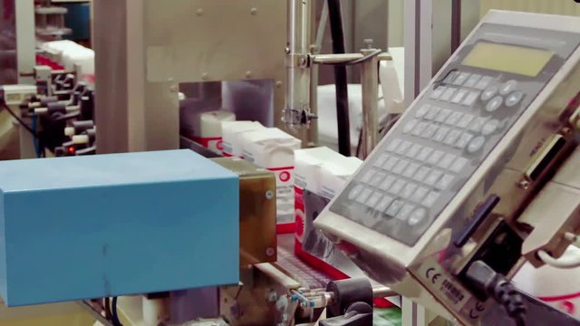 Packing sugar on a conveyor belt in a factory for processing sugar beet, 4 K Video Clip