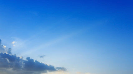 light rays on clear blue sky background
