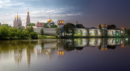 Fototapeta na wymiar Novodevichy convent, also known as Bogoroditse-Smolensky monastery. Day-to-night combination of two high dynamic range photos, taken from same point.