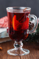 Mulled wine with spices on dark background