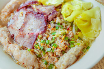 Noodles pork dumplings,spicy soup thai style