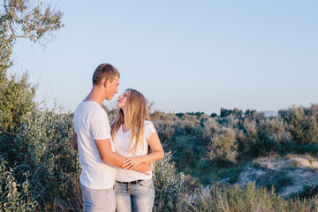 young couple embracing outdoors