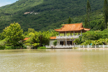 Fototapeta na wymiar Small chinese house on lake
