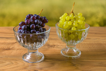 Fresh ripe grapes on a wooden table, rustic style