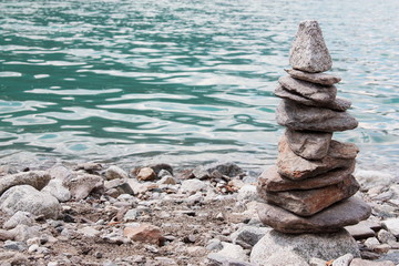 Human made pile of stones near a river