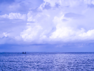 Fishing boat and purple sea