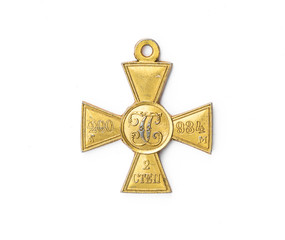 Naklejka premium old Russian medal in the shape of a cross on a white background